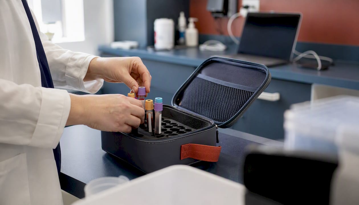 Clinician handling blood samples for labs
